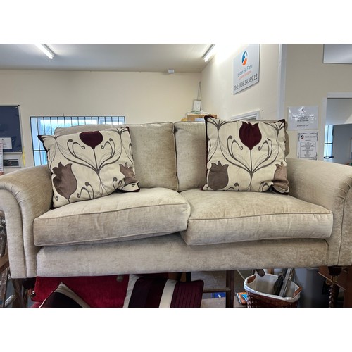 590 - Laura Ashley beige two seater with arm protectors and two cushions measures approx 73 inches wide by... 