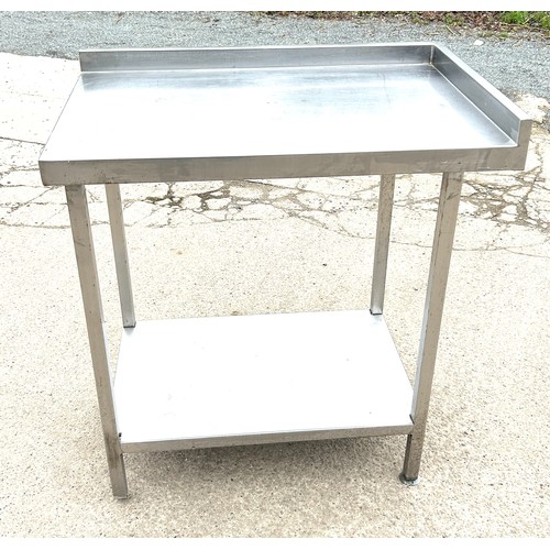 100E - Stainless steel table , approximate measurements Height 36 inches. Width 33 inches, Depth 22 inches