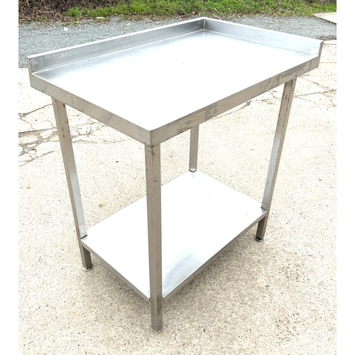 100E - Stainless steel table , approximate measurements Height 36 inches. Width 33 inches, Depth 22 inches