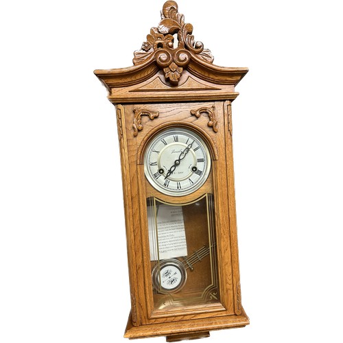 10 - 2 Key hole 31 day wall clock, measures approximately 30 inches tall