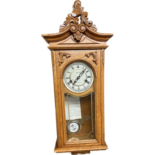 10 - 2 Key hole 31 day wall clock, measures approximately 30 inches tall