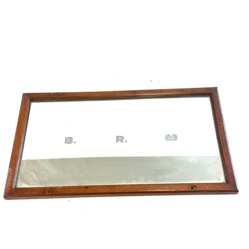 79 - Railway mirror measures approximately 16 inches by 9 inches