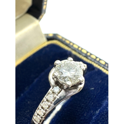 131 - Fine 18ct white gold diamond ring central diamond measures approx 5mm dia est 0.50ct with diamond sh... 