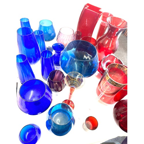 304 - Large selection of coloured glassware includes large vases etc