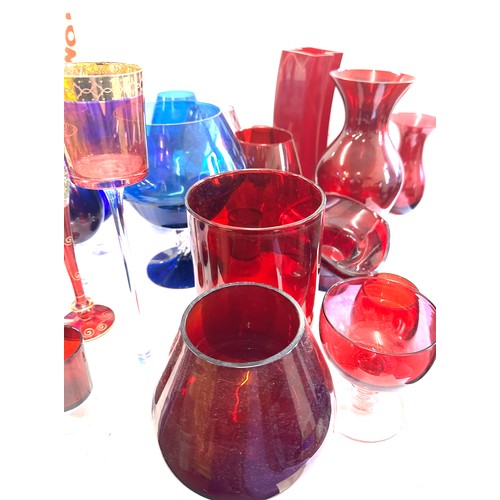 304 - Large selection of coloured glassware includes large vases etc