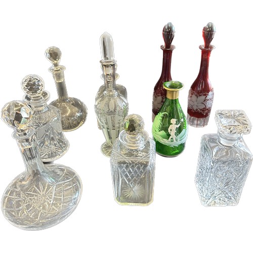 128 - 10 Cut glass decanters includes Mary Gregory etc