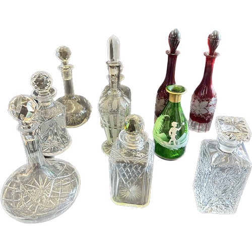 128 - 10 Cut glass decanters includes Mary Gregory etc