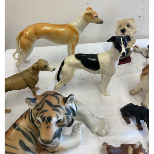 272 - Large selection of animal figures includes  Tigers, Corgi, French bulldog, dachshund et.