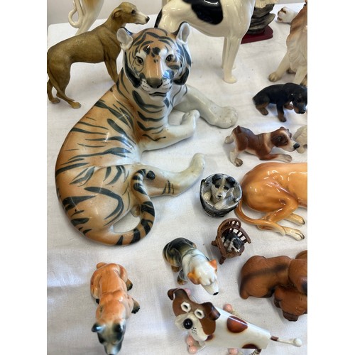 272 - Large selection of animal figures includes  Tigers, Corgi, French bulldog, dachshund et.