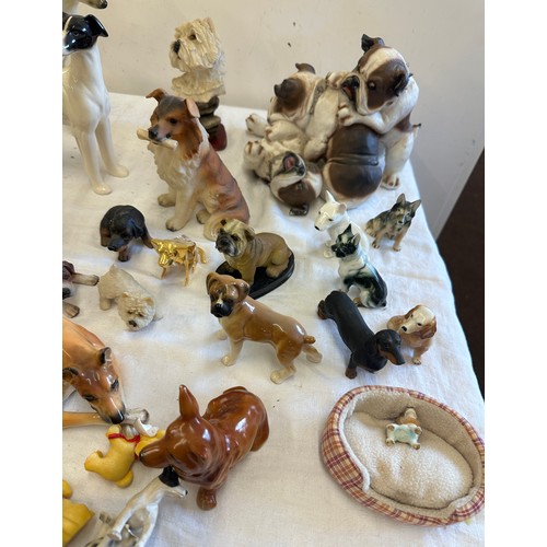 272 - Large selection of animal figures includes  Tigers, Corgi, French bulldog, dachshund et.