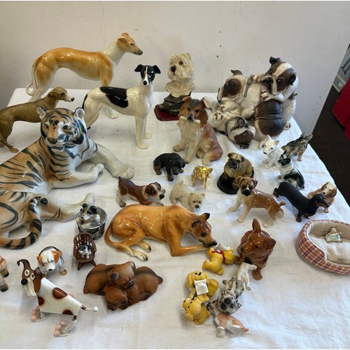 272 - Large selection of animal figures includes  Tigers, Corgi, French bulldog, dachshund et.