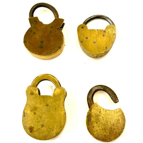 470 - Four antique brass padlocks