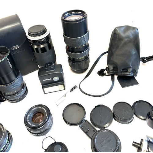 209 - Box of vintage camera equipment to include lenses, makers canon, Mitsuki, Rolleinar etc