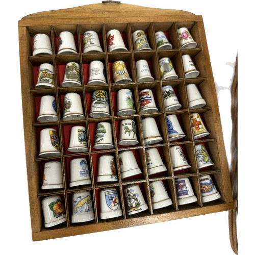 206 - Vintage thimbles, buttons and shells in a wicker picnic basket