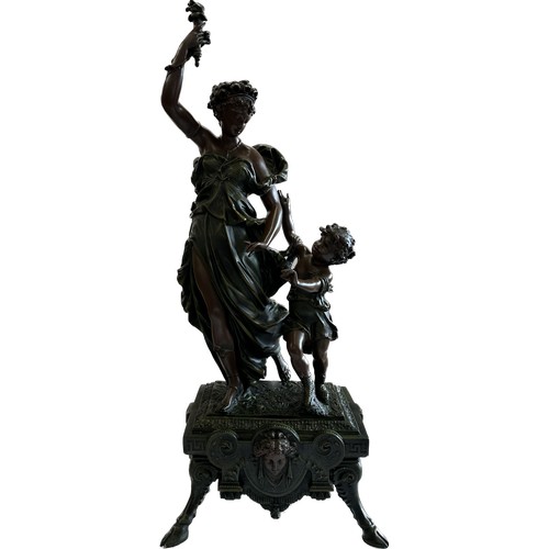 223 - Large resin decorative center piece of a mother and child, height approximately 29 inches