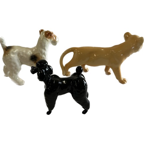 67 - Selection of Beswick lion cub, Terrier and black poodle