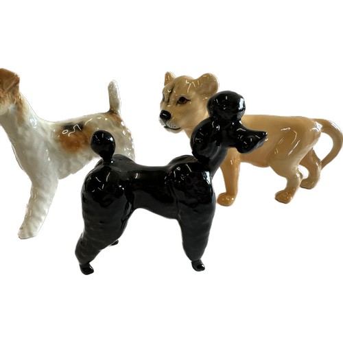 67 - Selection of Beswick lion cub, Terrier and black poodle