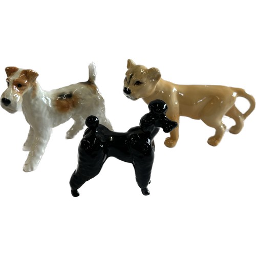 67 - Selection of Beswick lion cub, Terrier and black poodle