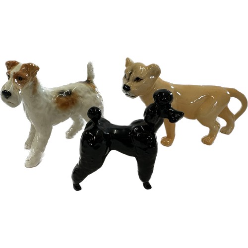 67 - Selection of Beswick lion cub, Terrier and black poodle