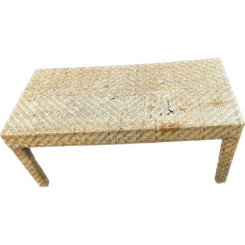 380 - Straw coffee table measures approximately 35 inches long 16 inches tall 18 inches depth