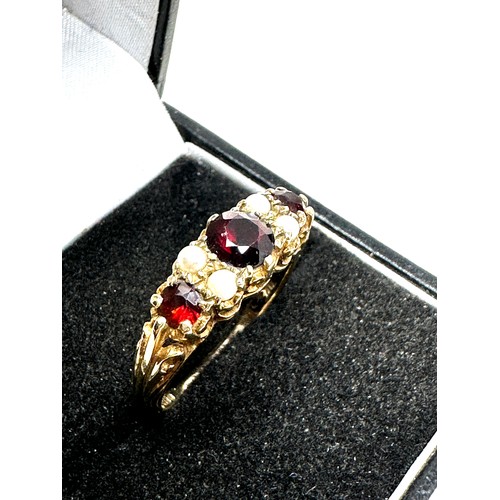 227 - 9ct gold garnet & pearl seven stone ring (3.2g)