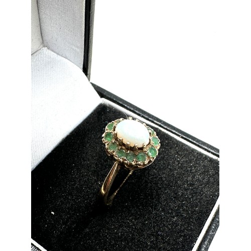 228 - 9ct gold opal & emerald halo ring (2.1g)