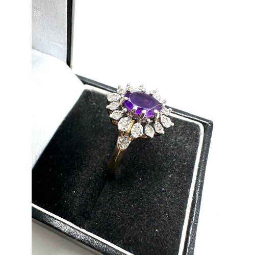 304 - 9ct gold amethyst single stone ring with diamond surround (3g)