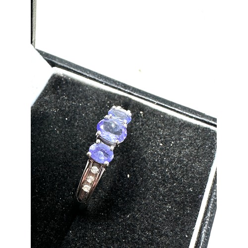 301 - 9ct white gold tanzanite ring with diamond shoulders (2.2g)