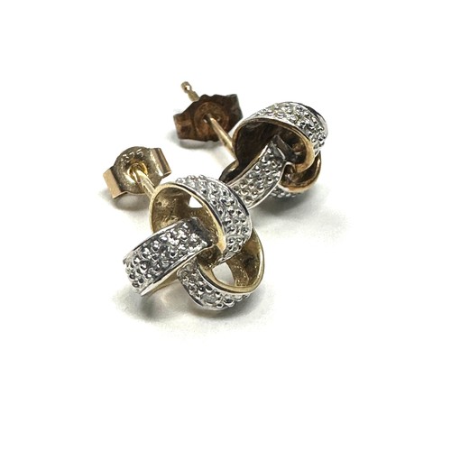 270 - 9ct gold paired diamond knot stud earrings (1.4g)