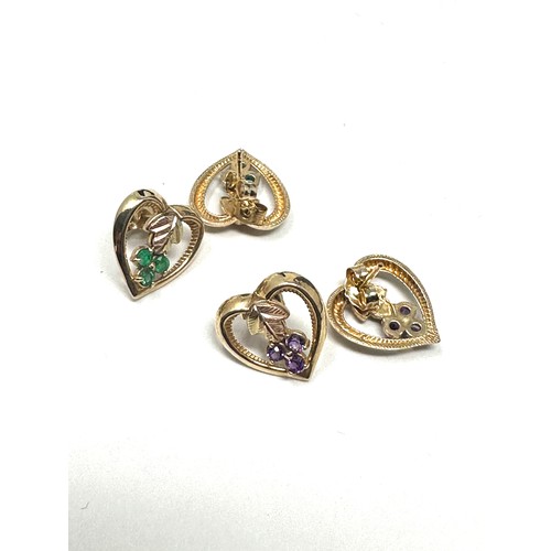 260 - 2 x 10 ct gold paired stud earrings inc. amethyst, emerald (3.8g)