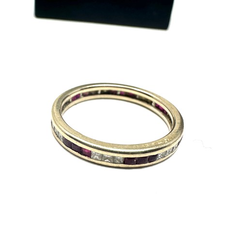 216 - 18ct gold diamond & ruby eternity ring (2.5g)