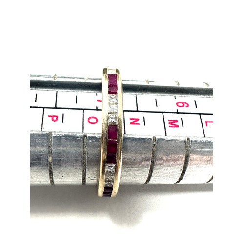 216 - 18ct gold diamond & ruby eternity ring (2.5g)