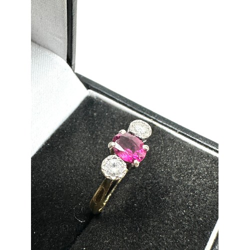 219 - 18ct gold diamond & ruby three stone ring (2.8g)