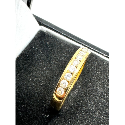 194 - 18ct gold diamond half eternity ring (2.7g)