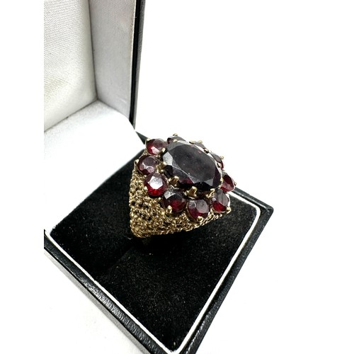 199 - 9ct gold garnet cocktail ring (9g)