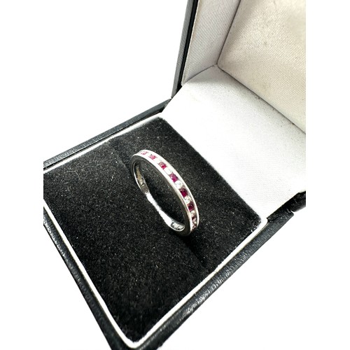 205 - 9ct white gold diamond & ruby half eternity ring (2.1g)