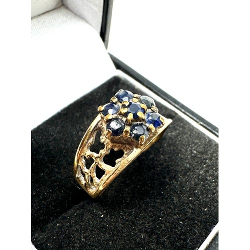 172 - 9ct gold sapphire floral cluster ring with openwork shank (3.6g)