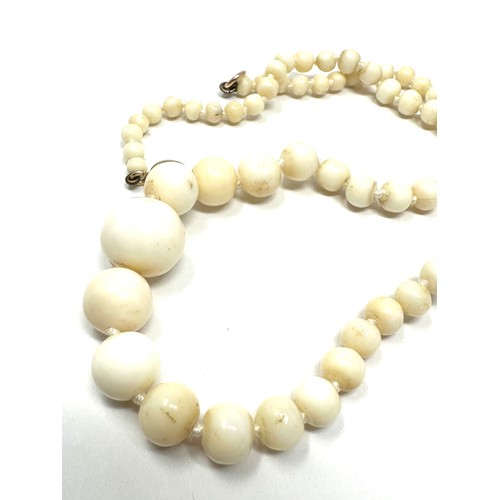 176 - 9ct gold clasp antique white coral graduated necklace (25.6g)