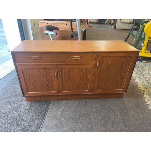 376 - 1 drawer 3 door Teak G Plan sideboard measures approximately 28 inches tall 54 inches wide 17.5 inch... 