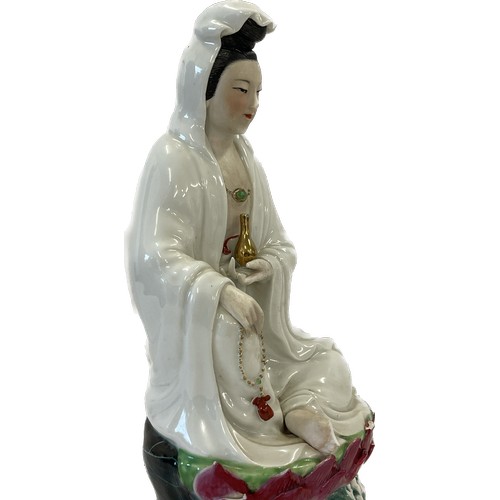 91 - Sitting Chinese Guanyin multi coloured goddess of Mercy, approximate height 10 inches, marks to base... 