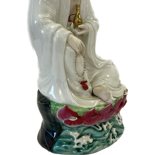 91 - Sitting Chinese Guanyin multi coloured goddess of Mercy, approximate height 10 inches, marks to base... 