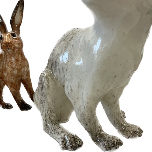 125 - Winstanley brown hare with glass eyes, approximate height 10 inches, size 5 together with a Winstanl... 