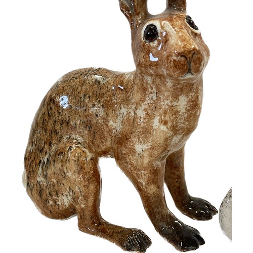 125 - Winstanley brown hare with glass eyes, approximate height 10 inches, size 5 together with a Winstanl... 