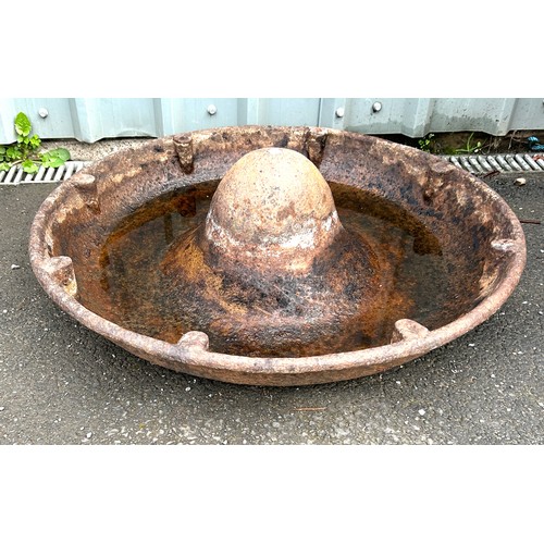 100S - Cast iron Mexican hat trough, approximate measurements 34 inches diameter, 10 inches tall