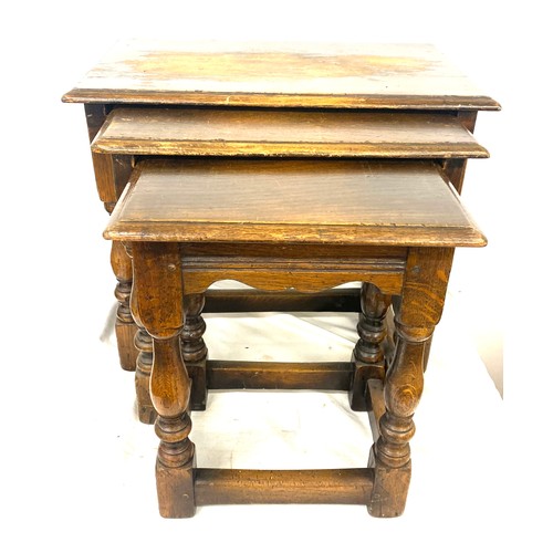 411A - Nest of 3 oak table measures approx 17 inches tall 20 inches wide 12 inches depth