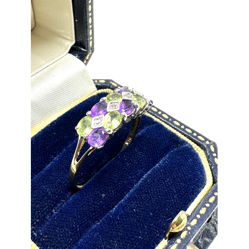 283 - 9ct gold diamond, peridot & amethyst dress ring (2.2g)