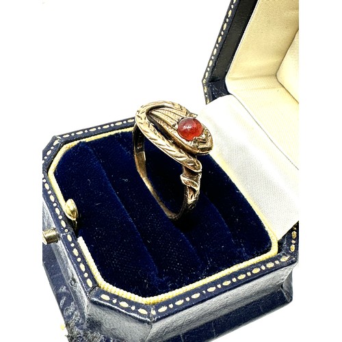 228 - 9ct gold garnet set snake ring (6.3g)