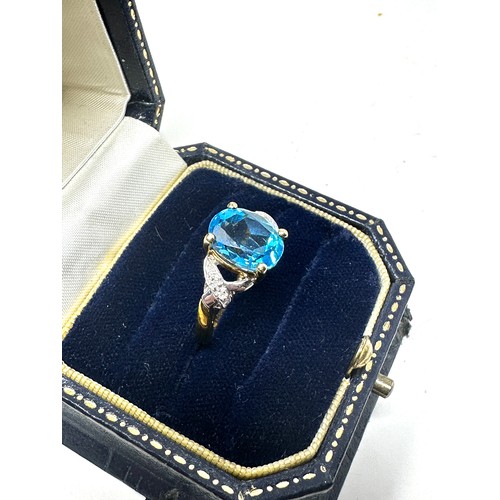 221 - 9ct gold diamond & topaz dress ring (2.7g)