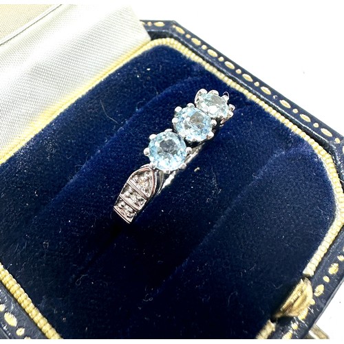 198 - 9ct white gold topaz ring with diamond shoulders (2.7g)