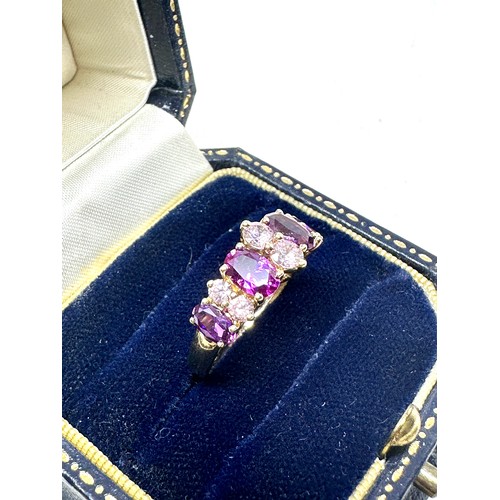 234 - 9ct gold purple sapphire & pink gemstone dress ring (2.4g)